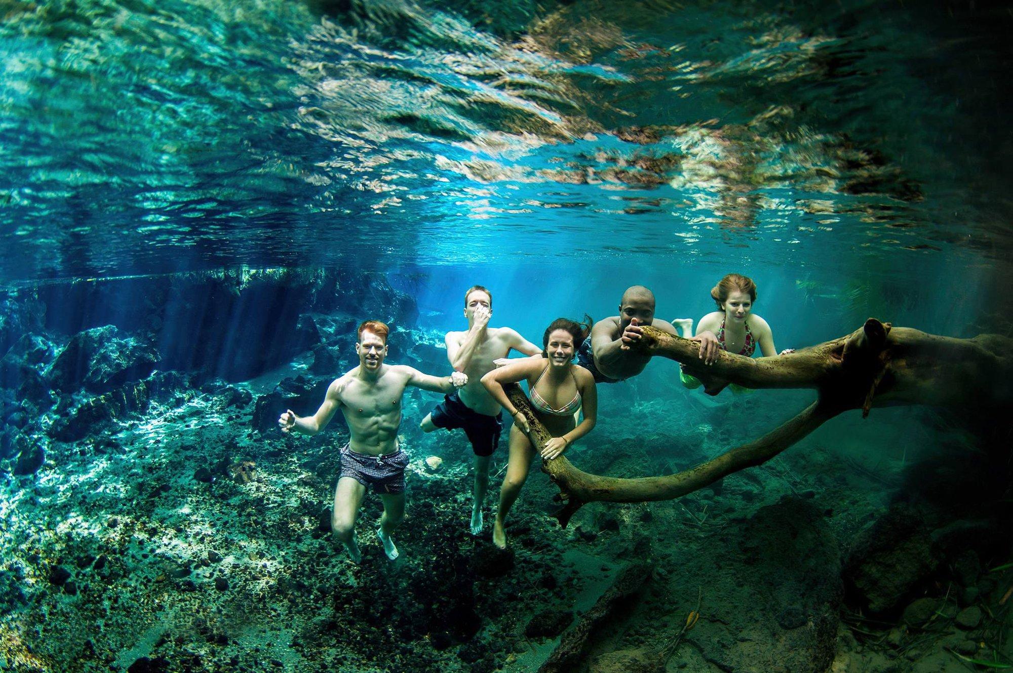 Crystal-clear turquoise natural spring surrounded by palm trees — Chemka Hot Springs Tanzania